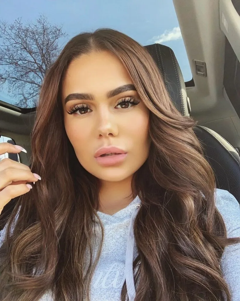 Girl in grey top posing for selfie and showing her Hot Toffee Blonde color with front pose Girl in grey top posing for selfie and showing her Hot Toffee Blonde color with front pose - hair color