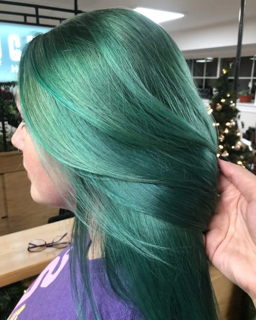 A girl is showing the side view of her sage green hair color A girl is showing the side view of her sage green hair color - latest green hair color 2022