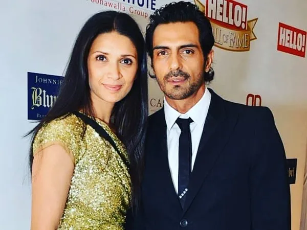 Arjun Rampal posing with wife Mehe Jesia in a public event  Arjun Rampal posing with wife Mehe Jesia in a public event - celebrity divorce