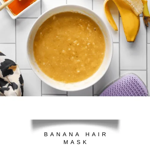 Mashed banana with honey in a white bowl - hair fall control mask