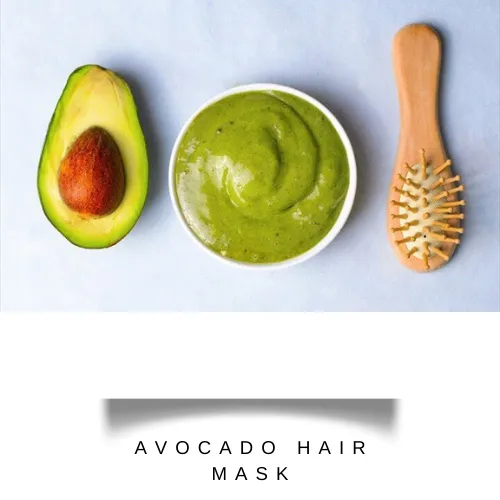 meshed avocado with aloe vera gel and coconut oil in a bowl with a comb - hair fall treatment