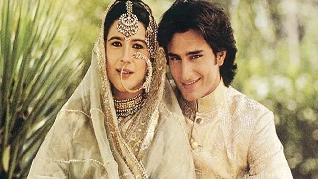 Saif and Amrita posing for camera in wedding dress Saif and Amrita posing for camera in wedding dress - Bollywood divorces