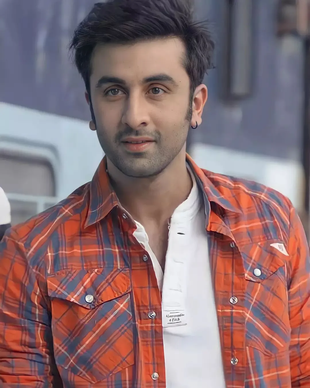 Ranbir Kapoor in blue and orange check shirt showing his textured short fringes - Ranbir Kapoor Latest hairstyles