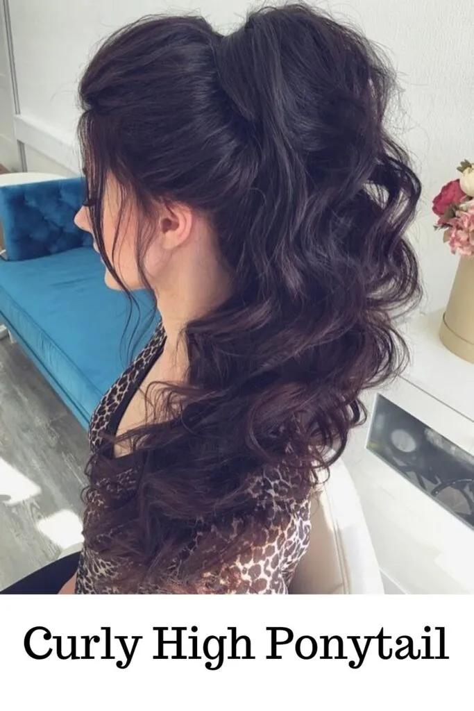 A lady in printed top showing her curly high ponytail - ponytail curls hairstyles