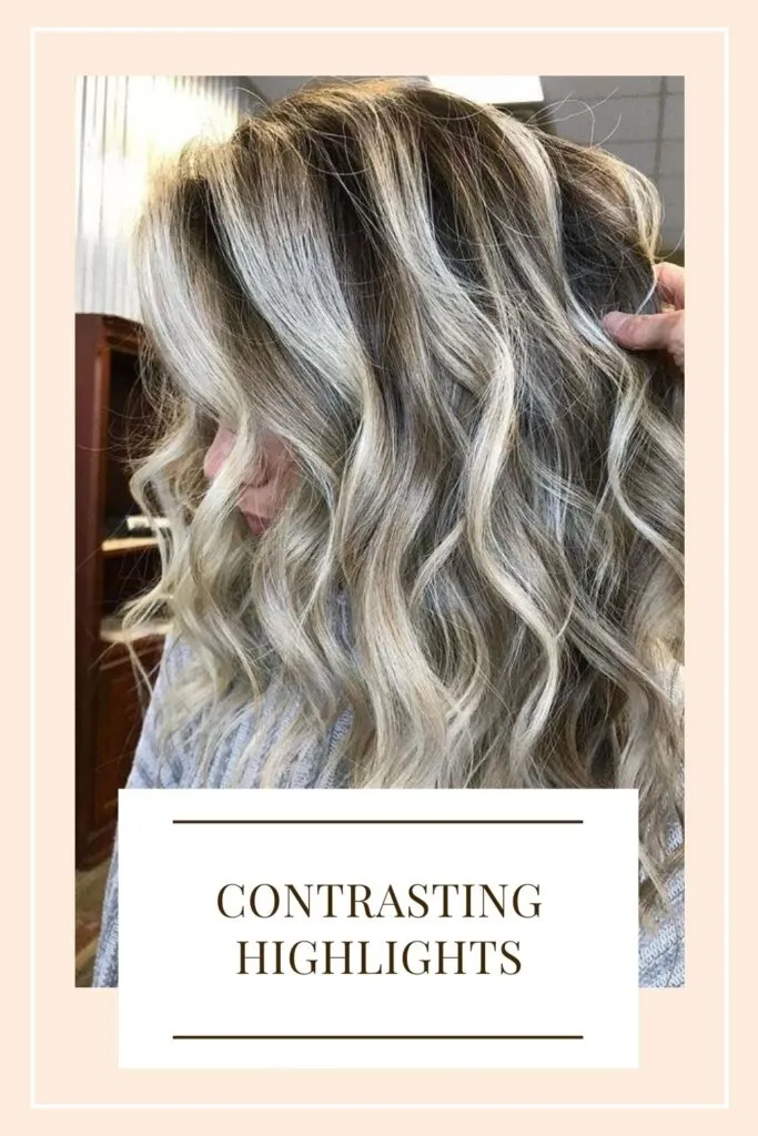 A lady is showing her Contrasting Highlights for 2021 - hair color for women short hair