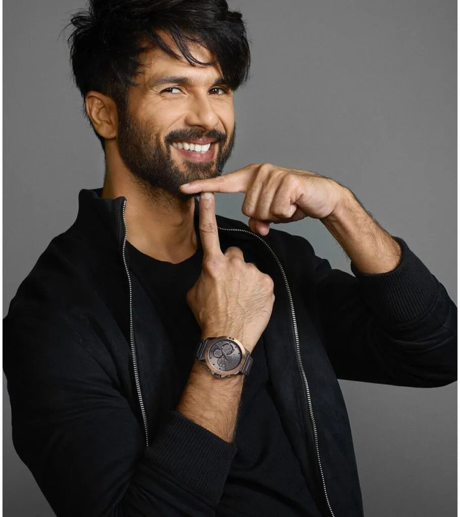 Shahid Kapoor in all black outfit smiling and posing for camera Shahid Kapoor in all black outfit smiling and posing for camera - list of handsome actors in bollywood