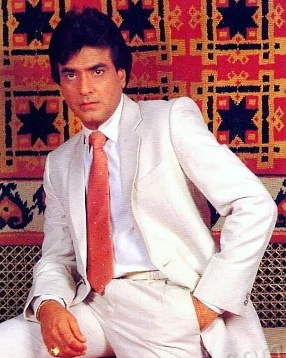 Jeetendra in white suit with red tie posing for camera Jeetendra in white suit with red tie posing for camera - handsome man in India 2021