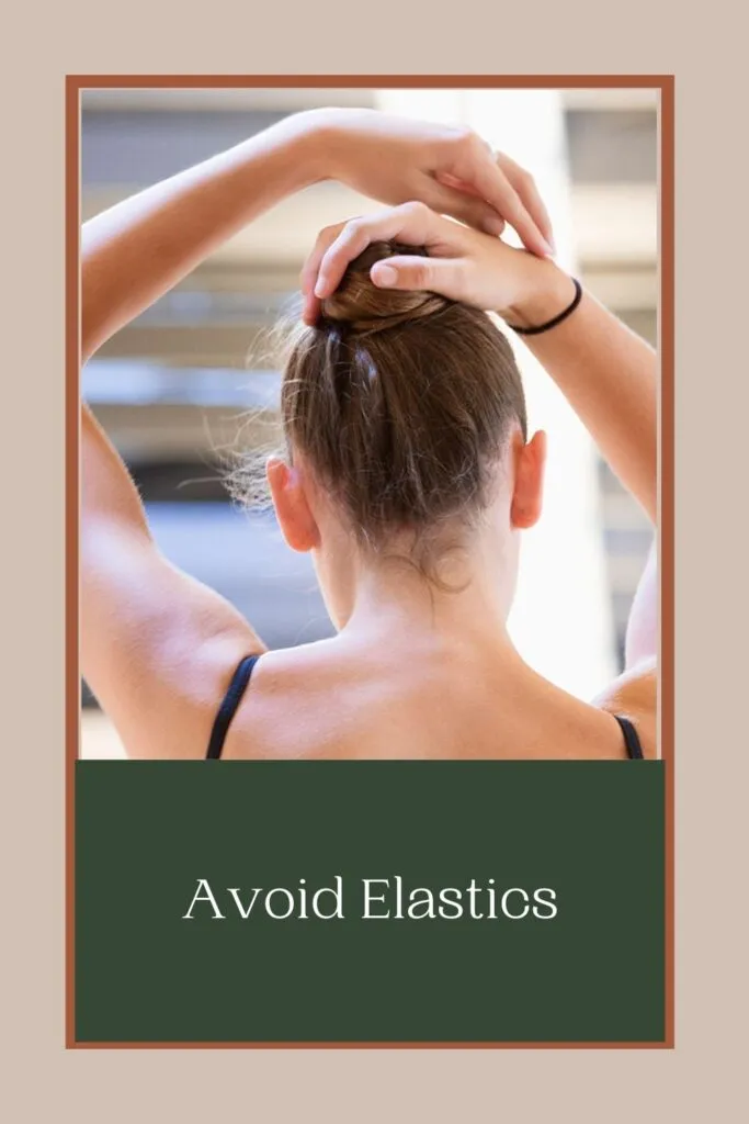 A girl is going to tie her hair with an elastic band A girl is going to tie her hair with an elastic band - 7 days hair care routine