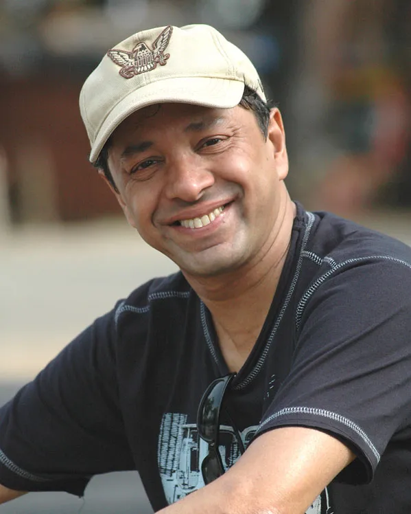 Sridhar Rangayan is smiling and sitting in grey t-shirt Sridhar Rangayan is smiling and sitting in grey t-shirt - lesbian celebrities Bollywood