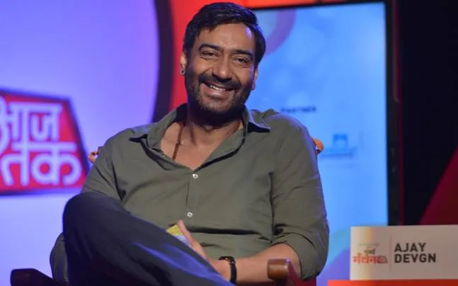 Smiling Ajay Devgn posing for camera in without makeup look Smiling Ajay Devgn posing for camera in without makeup look - celebrities without makeup