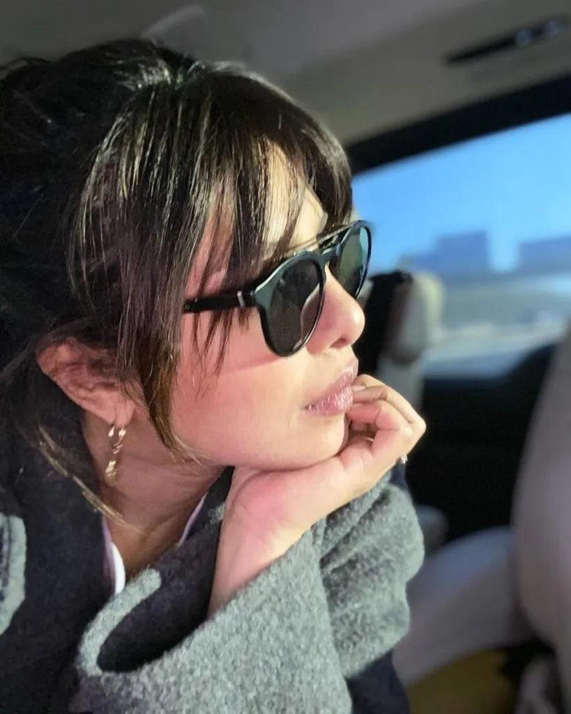 Priynaka Chopra in goggles showing her bang on hairstyles - Priyanka Chopra latest hairstyles