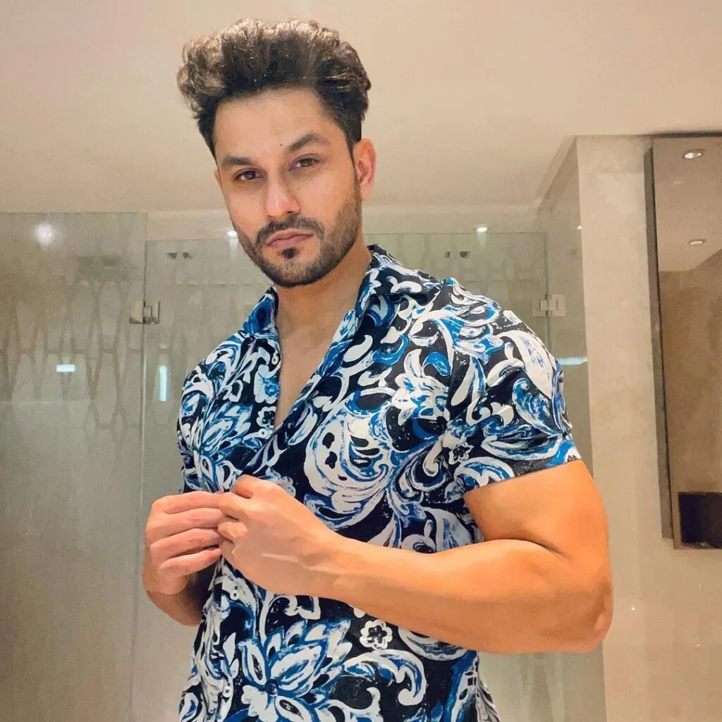Kunal Khemu in multicolor printed shirt posing for camera Kunal Khemu in multicolor printed shirt posing for camera - short bollywood male actors