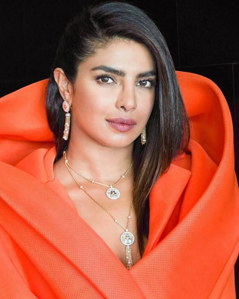 Priyanka Chopra in orange dress and side swept hairstyle - priyanka chopra latest hairstyles