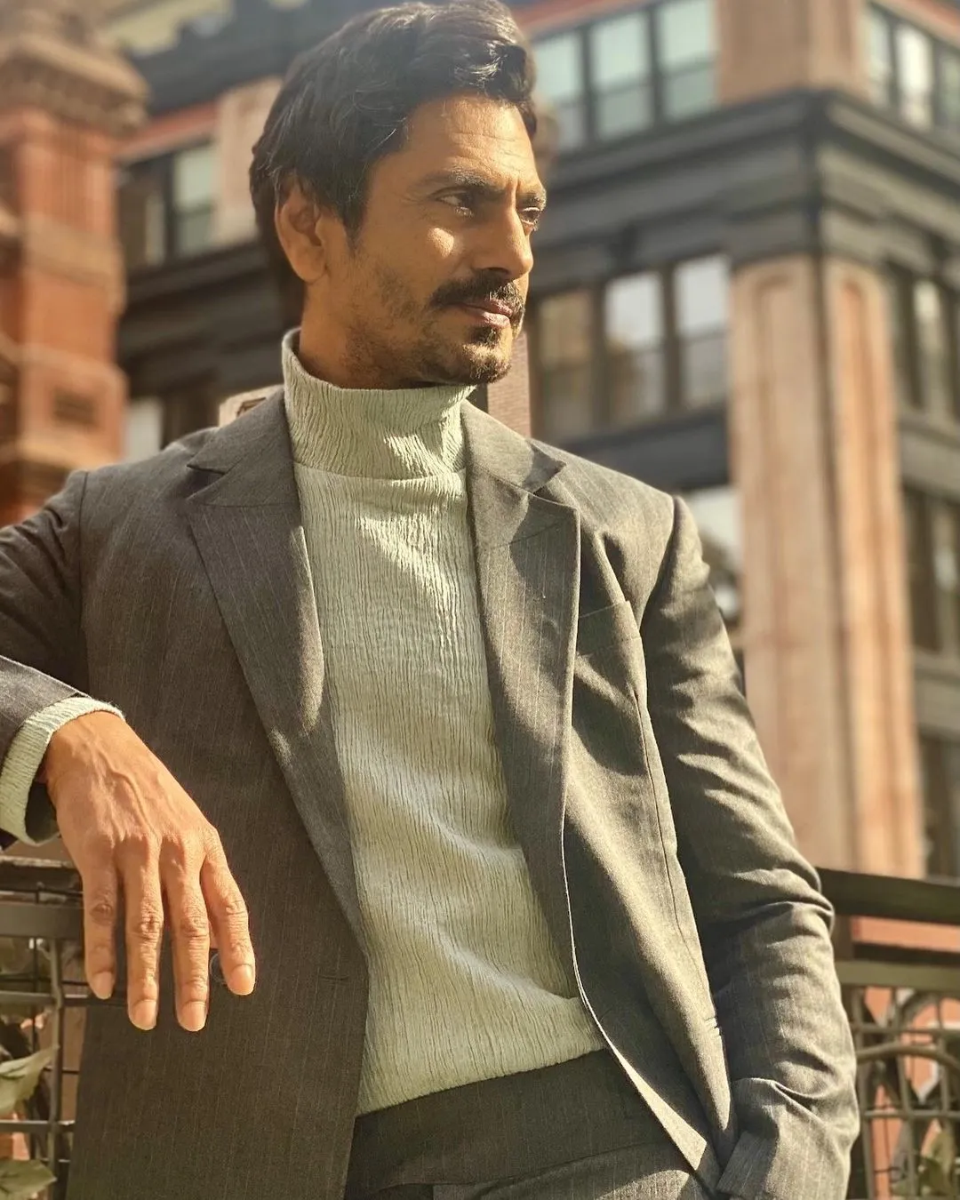 Nawazuddin Siddiqui in grey jacket and off white high neck inner posing for camera Nawazuddin Siddiqui in grey jacket and off white high neck inner posing for camera - list of short actors