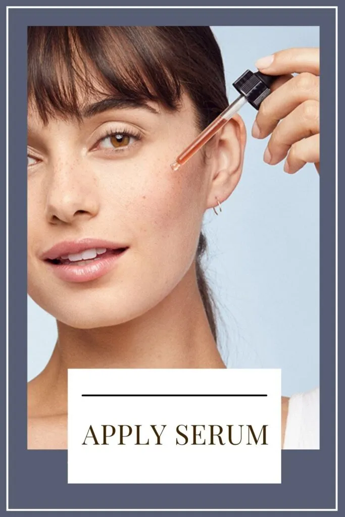 A girl is applying serum on her face A girl is applying serum on her face - face care tips