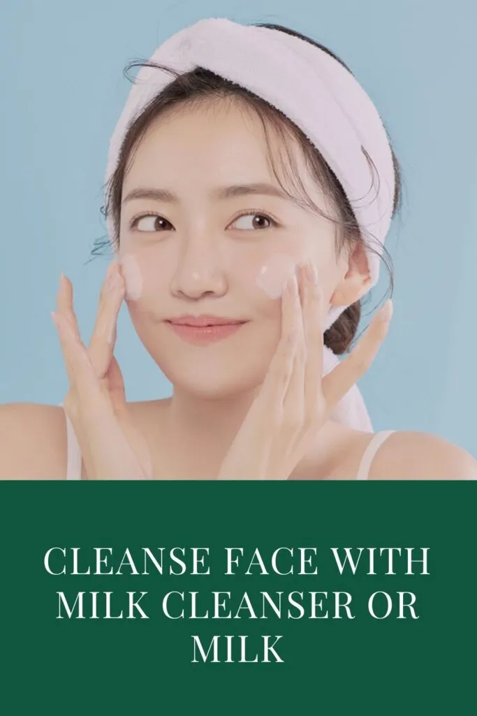 A girl is cleaning her face with milk cleanser A girl is cleaning her face with milk cleanser - night skin care