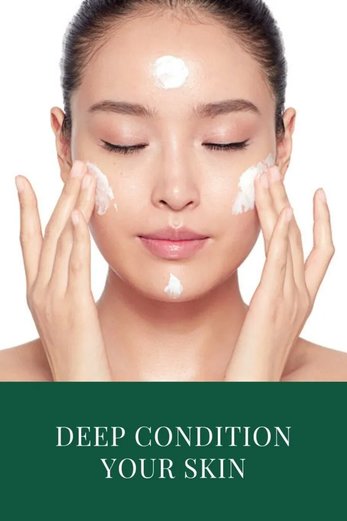 A girl is applying deep conditioning cream on her face A girl is applying deep conditioning cream on her face - night skincare routine