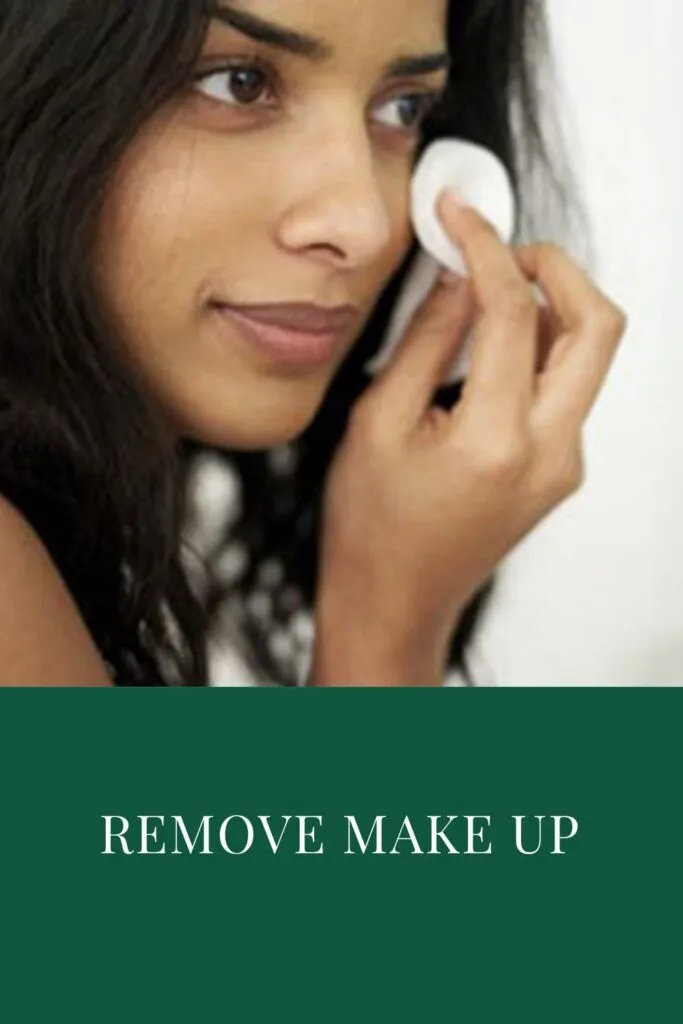 A girl is removing her makeup with makeup remover A girl is removing her makeup with makeup remover - night skincare routine