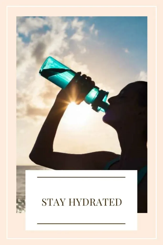 A girl is drinking water with a bottle A girl is drinking water with a bottle - winter skin care routine