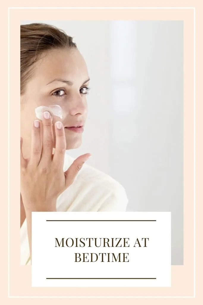 A girl is applying moisturizer on her face A girl is applying moisturizer on her face - winter skin care routine
