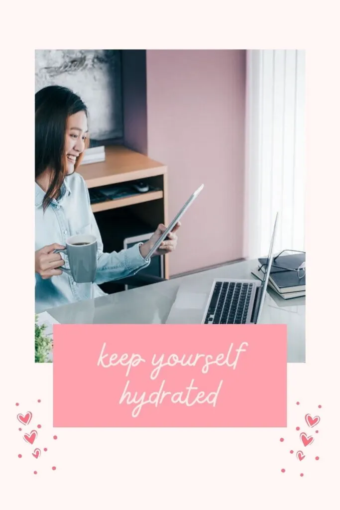 A women working in office and having some drink A women working in office and having some drink - stay healthy and fit