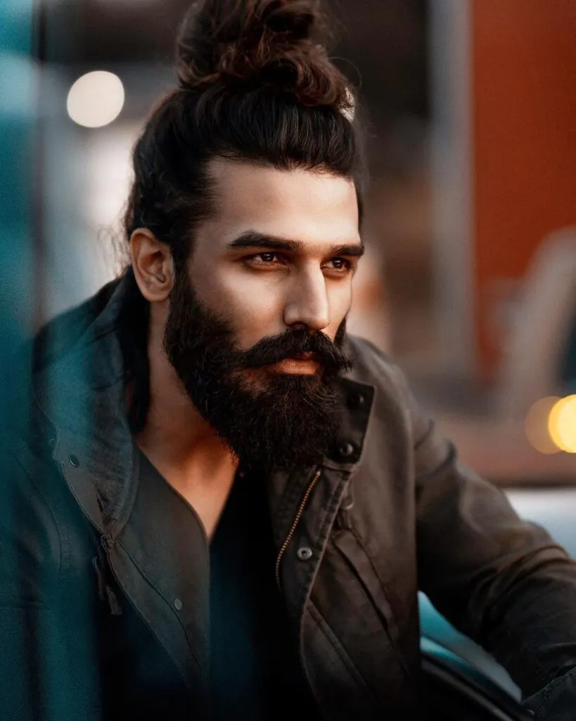 Nitin Chauhan in black jacket posing for camera - models in India 2022