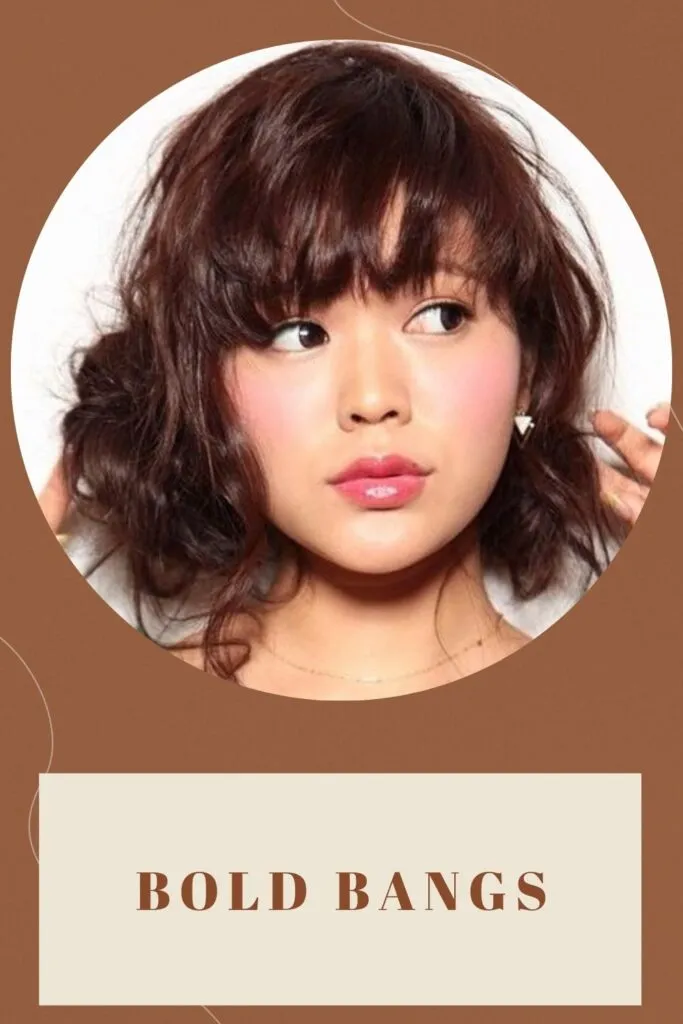 A girl showing her Bold Bangs hairstyles - short haircut for round face