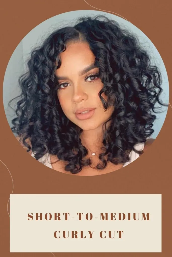 A beautiful girl is showing her Short-to-Medium Curly Cut hairstyle - short haircut for round face