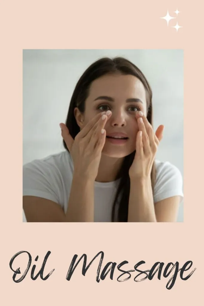A lady in white t-shirt giving Oil Massage to her under eye area A lady in white t-shirt giving Oil Massage to her under eye area - dark circles