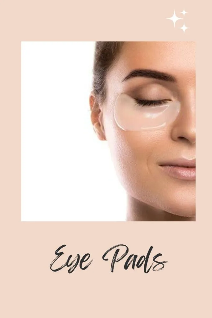 A smiling women applying eye pads on her under eye area A smiling women applying eye pads on her under eye area - under eye care