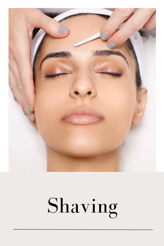 A lady is removing her facial hair with razor A lady is removing her facial hair with razor - Remove Facial Hair