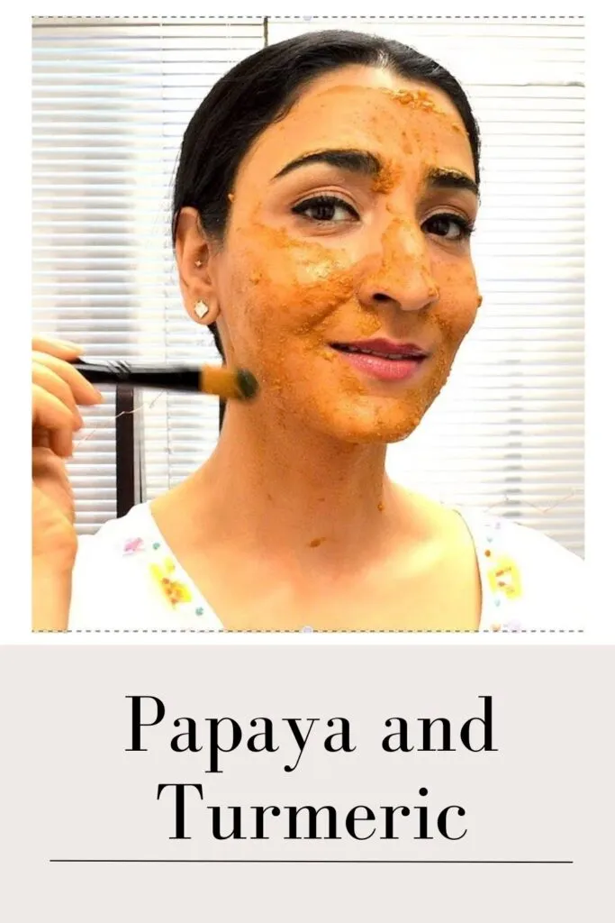 A women is applying Papaya and turmeric face mask with a brush A women is applying Papaya and turmeric face mask with a brush - pigmentation