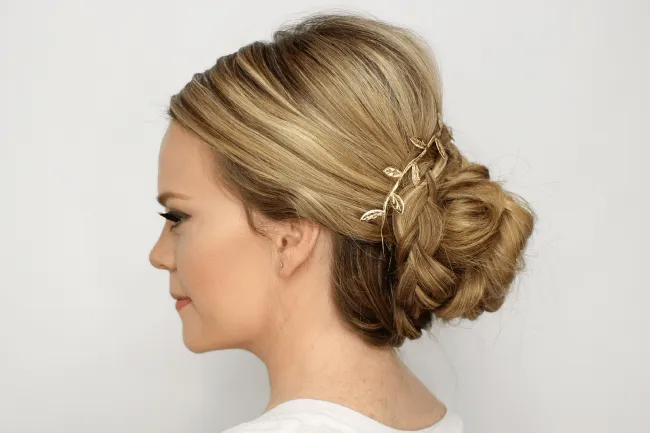 A girl in white dress showing the side view of her Simple Braided Bun A girl in white dress showing the side view of her Simple Braided Bun - hairstyles for girls