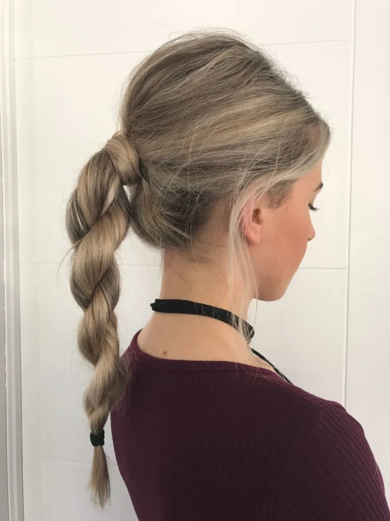A girl in marron top showing her Rope braid ponytail A girl in marron top showing her Rope braid ponytail - hairstyles for long hair