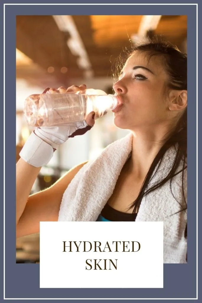 A girl is drinking water with bottle A girl is drinking water with bottle - Working Out Affects