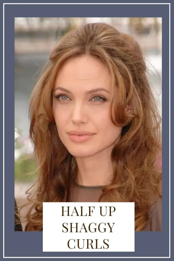 A girl in black net top showing her Half up shaggy curls - Oblong face shape