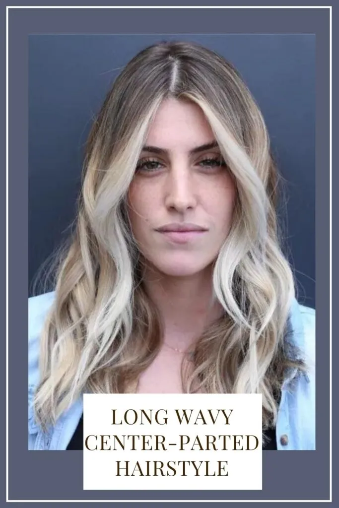 A girl in sky blue denim jacket showing her Long wavy center-parted hairstyle - braided hairstyles 