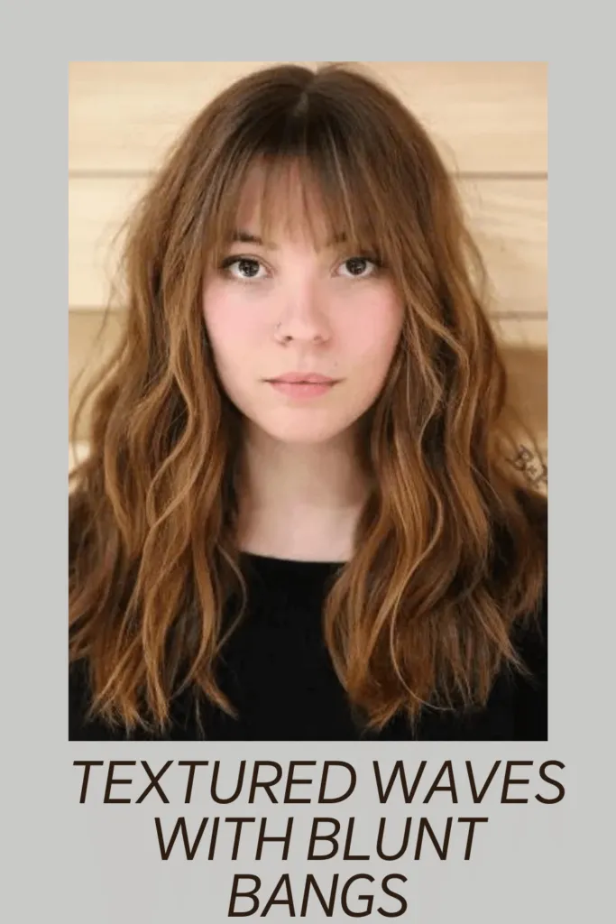 A girl in black top showing her Textured waves with blunt bangs hairstyle A girl in black top showing her Textured waves with blunt bangs hairstyle - hairstyles for Oval face 2022