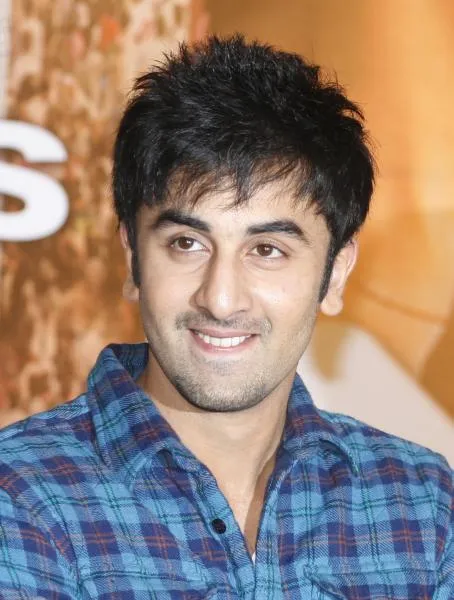 Smiling Ranbir Kapoor posing for camera and blue check shirt - Ranbir Kapoor hairstyle 2022