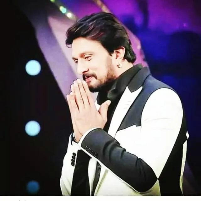 Kiccha Sudeep in black and white suit posing for camera Kiccha Sudeep in black and white suit posing for camera - handsome south indian actors