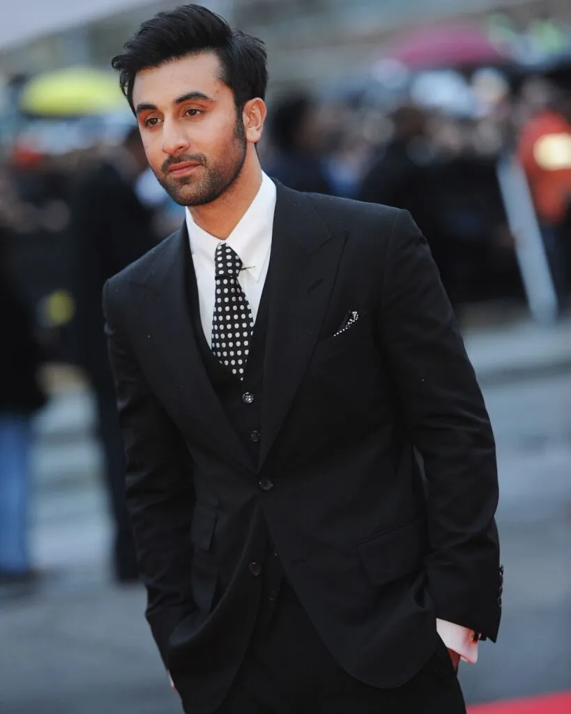 Ranbir Kapoor in black suit with white shirt posing for camera - Ranbir Kapoor hairstyles 