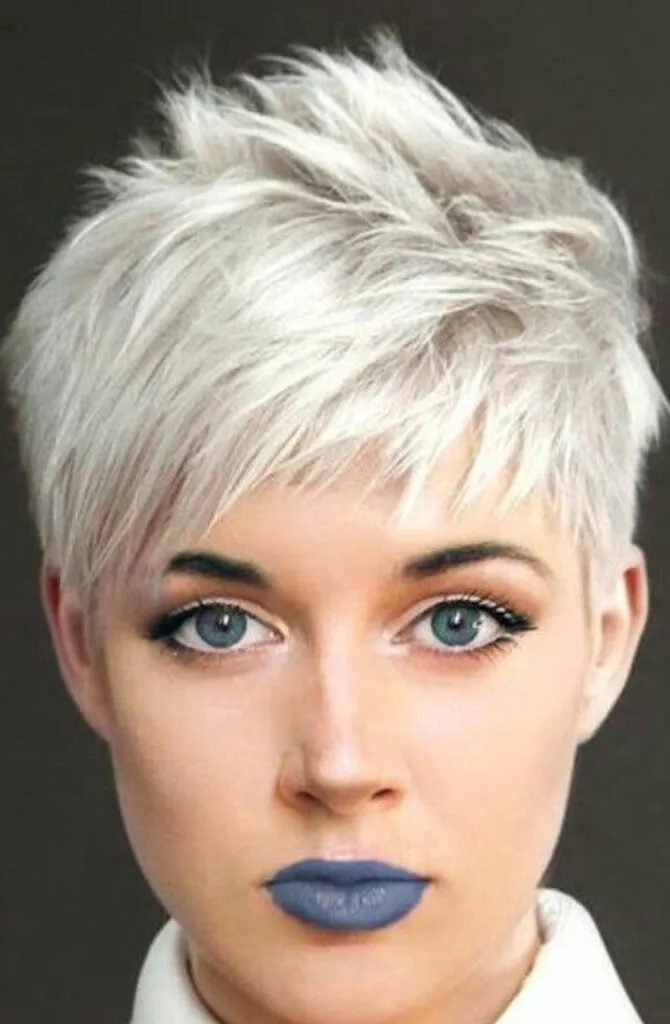 A girl in ash blond hair and blue lipstick showing her Scintillating Pixie Bob A girl in ash blond hair and blue lipstick showing her Scintillating Pixie Bob - short hairstyle for women