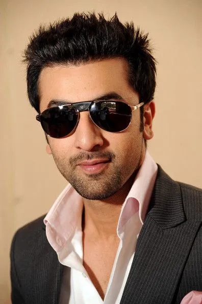 Ranbir Kapoor in pink shirt with lining coat and goggles posing for camera - ranbir kapoor hairstyles
