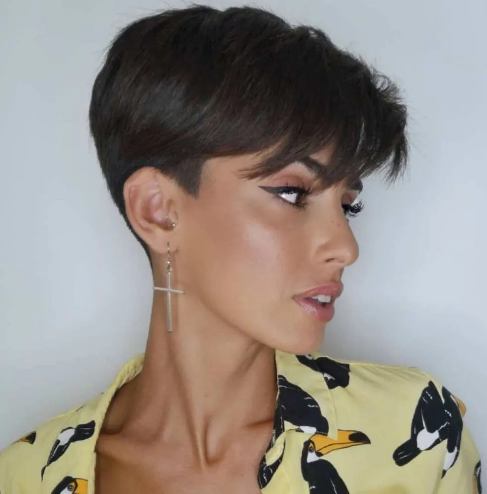 a girl in black and beige shirt posing for camera and showing her pixie bob a girl in black and beige shirt posing for camera and showing her pixie bob - hairstyle for women