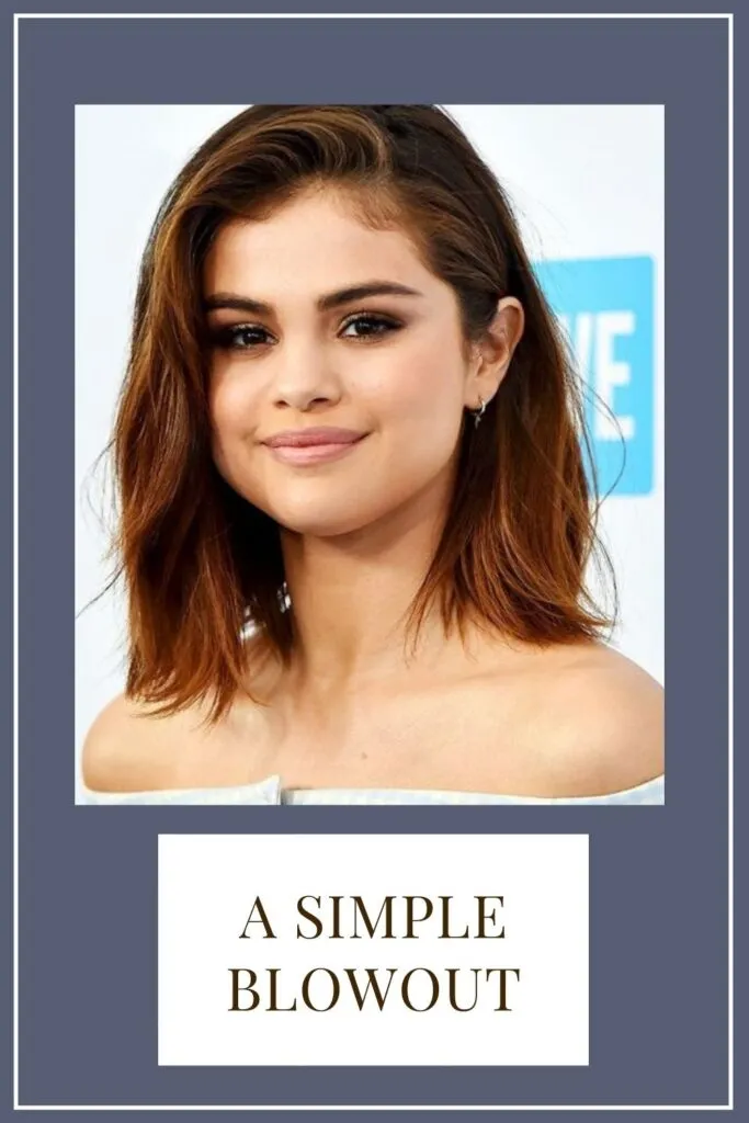 A girl in white off shoulder top posing for camera and showing her simple blowout hairstyle A girl in white off shoulder top posing for camera and showing her simple blowout hairstyle - long hair hairstyles