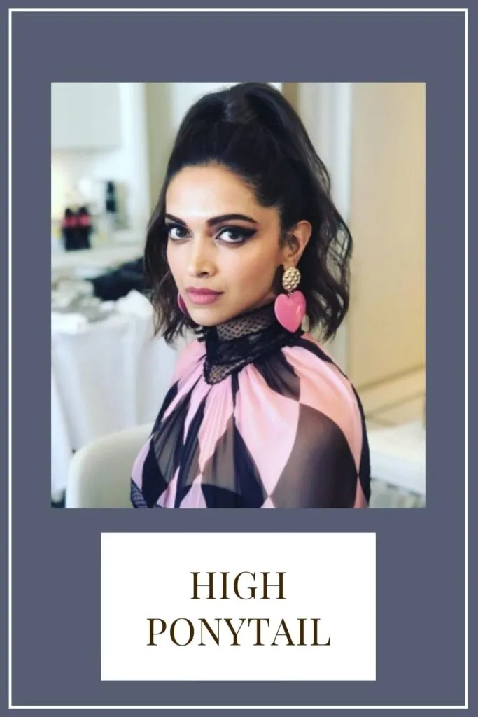 A girl in black and pink top with pink earing posing for camera in high ponytail A girl in black and pink top with pink earing posing for camera in high ponytail - Haircut for Heart Face