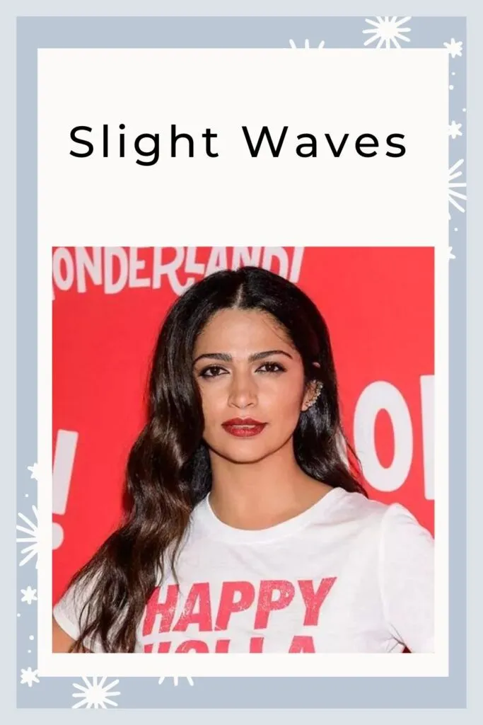 A girl in white t-shirt showing her Slight waves hairstyle A girl in white t-shirt showing her Slight waves hairstyle - long hair hairstyles