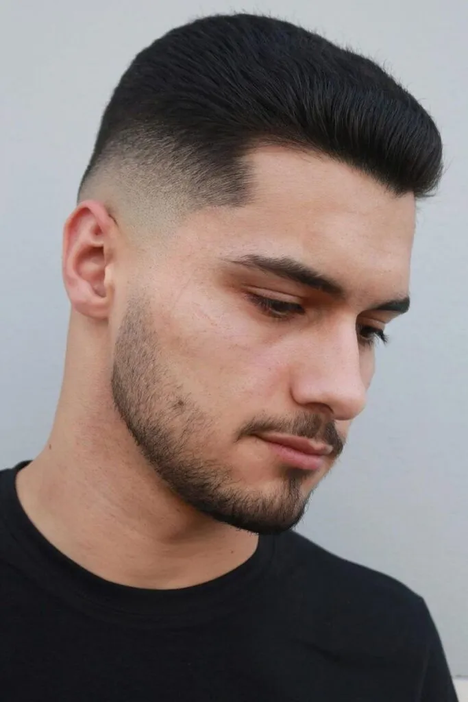 A man in black round neck t-shirt showing his Tousled Undercut A man in black round neck t-shirt showing his Tousled Undercut - haircut for men