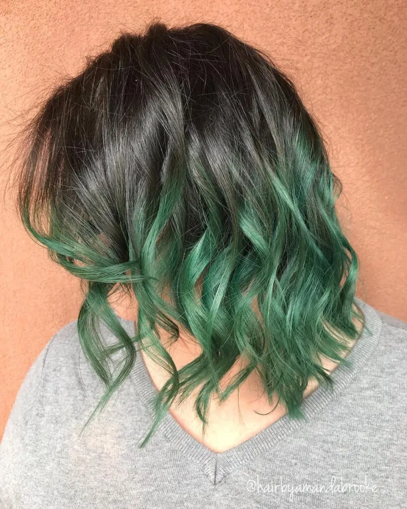 A girl in grey top showing the side view of her Black and Green Ombre Hair color A girl in grey top showing the side view of her Black and Green Ombre Hair color - green hair color