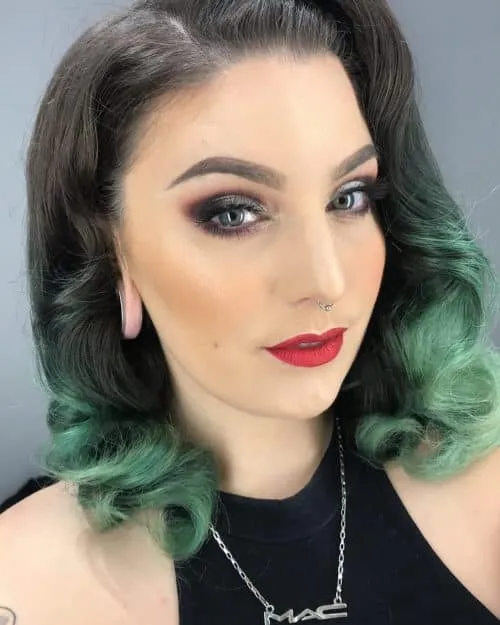 A girl in black cut sleeves top with bright red lipstick posing for camera and showing her Black Hair with green Teal Dip Dye A girl in black cut sleeves top with bright red lipstick posing for camera and showing her Black Hair with green Teal Dip Dye - green hair color for women